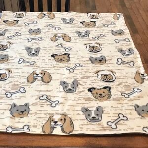 Tan & gray sweet dog faces grace this blanket with their fun bones.
